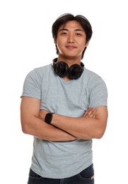 Photo of Portrait of handsome Asian man with headphones on white background