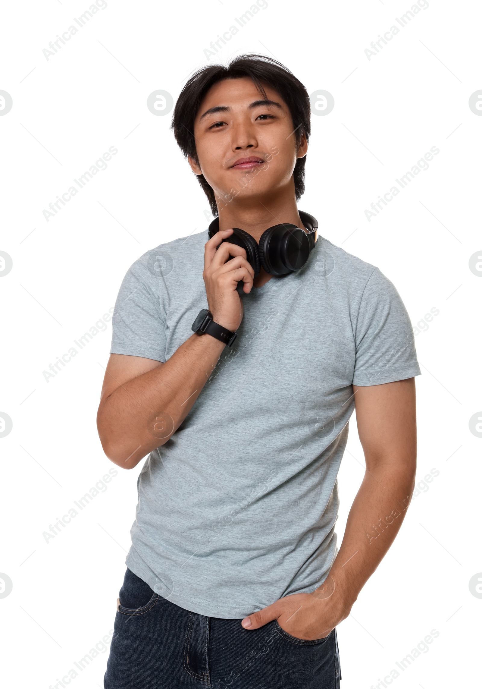 Portrait of handsome Asian man with headphones on white background Photo of Portrait of handsome Asian man with headphones on white background