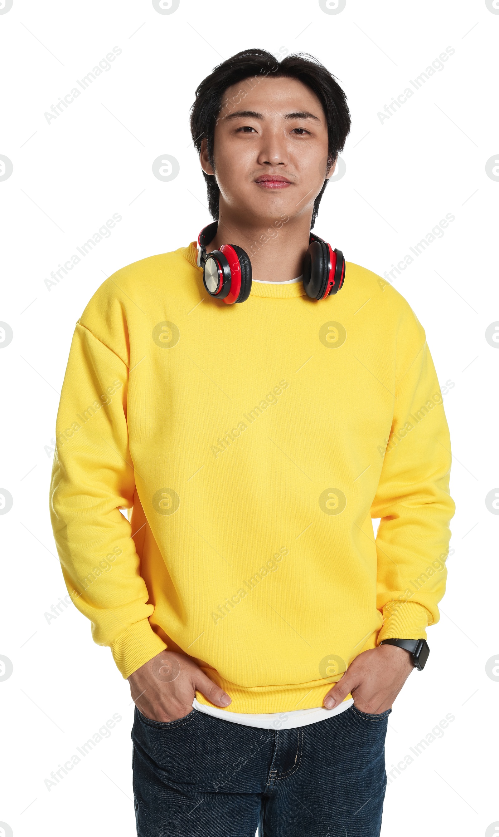 Portrait of handsome Asian man with headphones on white background Photo of Portrait of handsome Asian man with headphones on white background