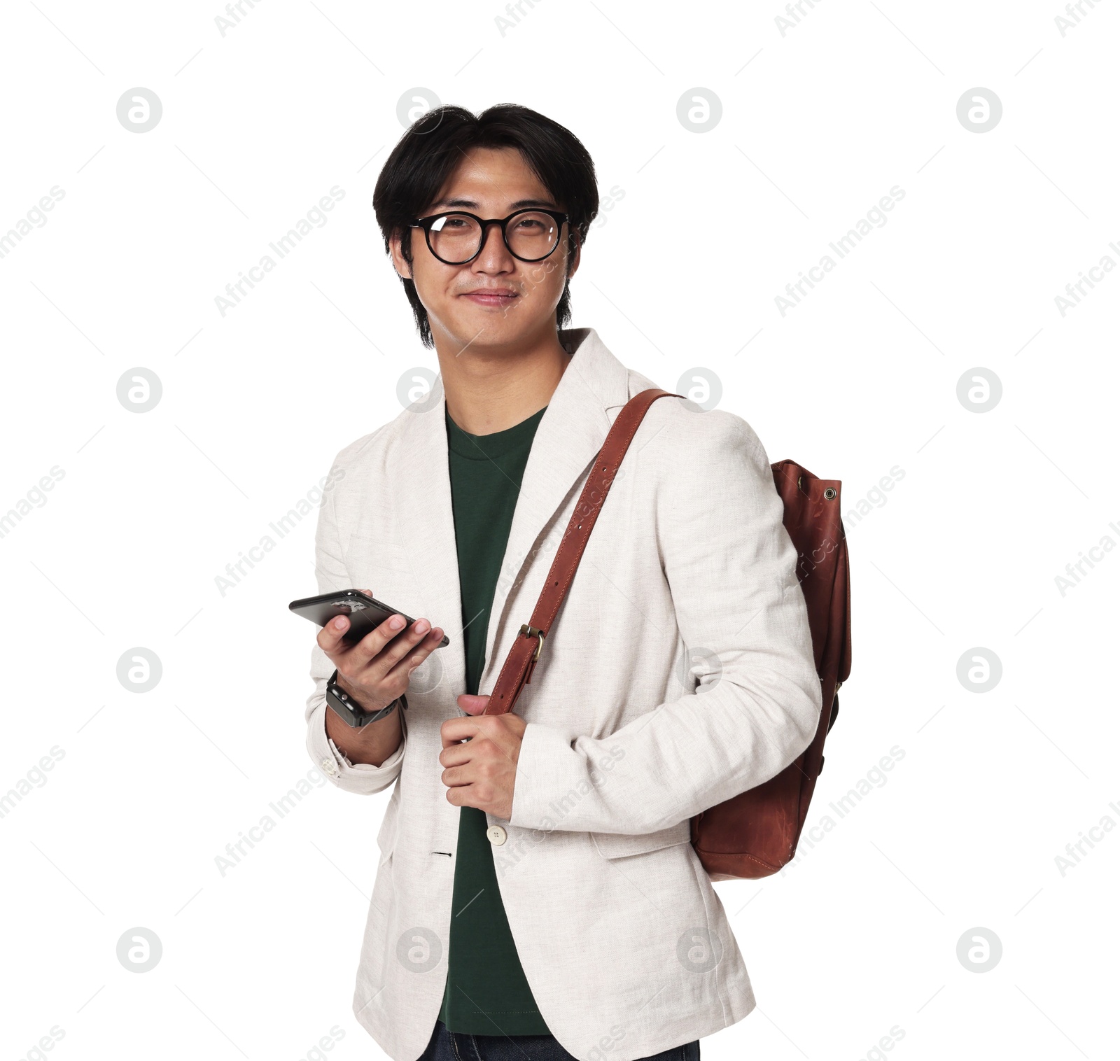 Portrait of handsome Asian man in glasses with smartphone and backpack on white background Photo of Portrait of handsome Asian man in glasses with smartphone and backpack on white background