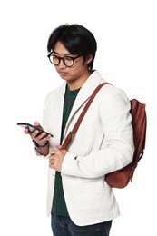 Photo of Portrait of handsome Asian man in glasses with smartphone and backpack on white background