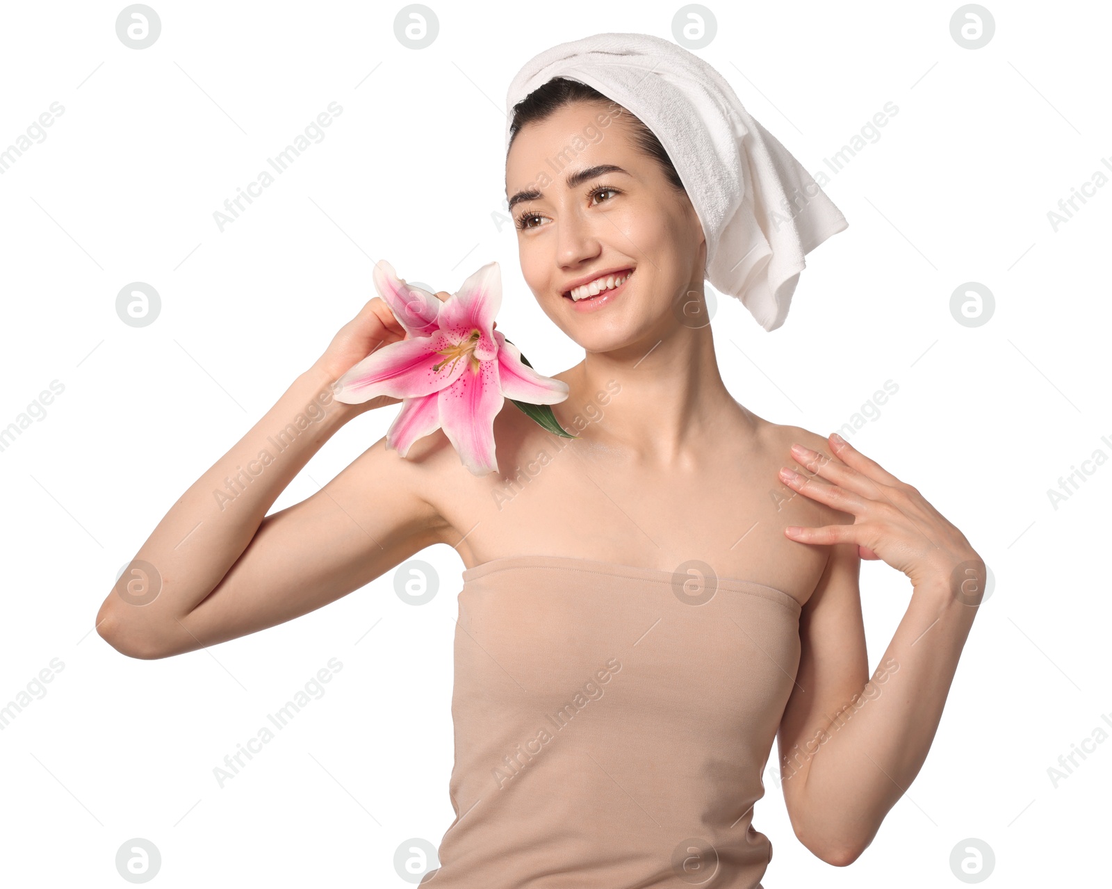 Smiling woman with lily flower after spa treatment on white background Photo of Smiling woman with lily flower after spa treatment on white background