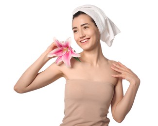 Photo of Smiling woman with lily flower after spa treatment on white background