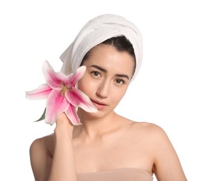 Photo of Portrait of beautiful woman with lily flower after spa treatment on white background