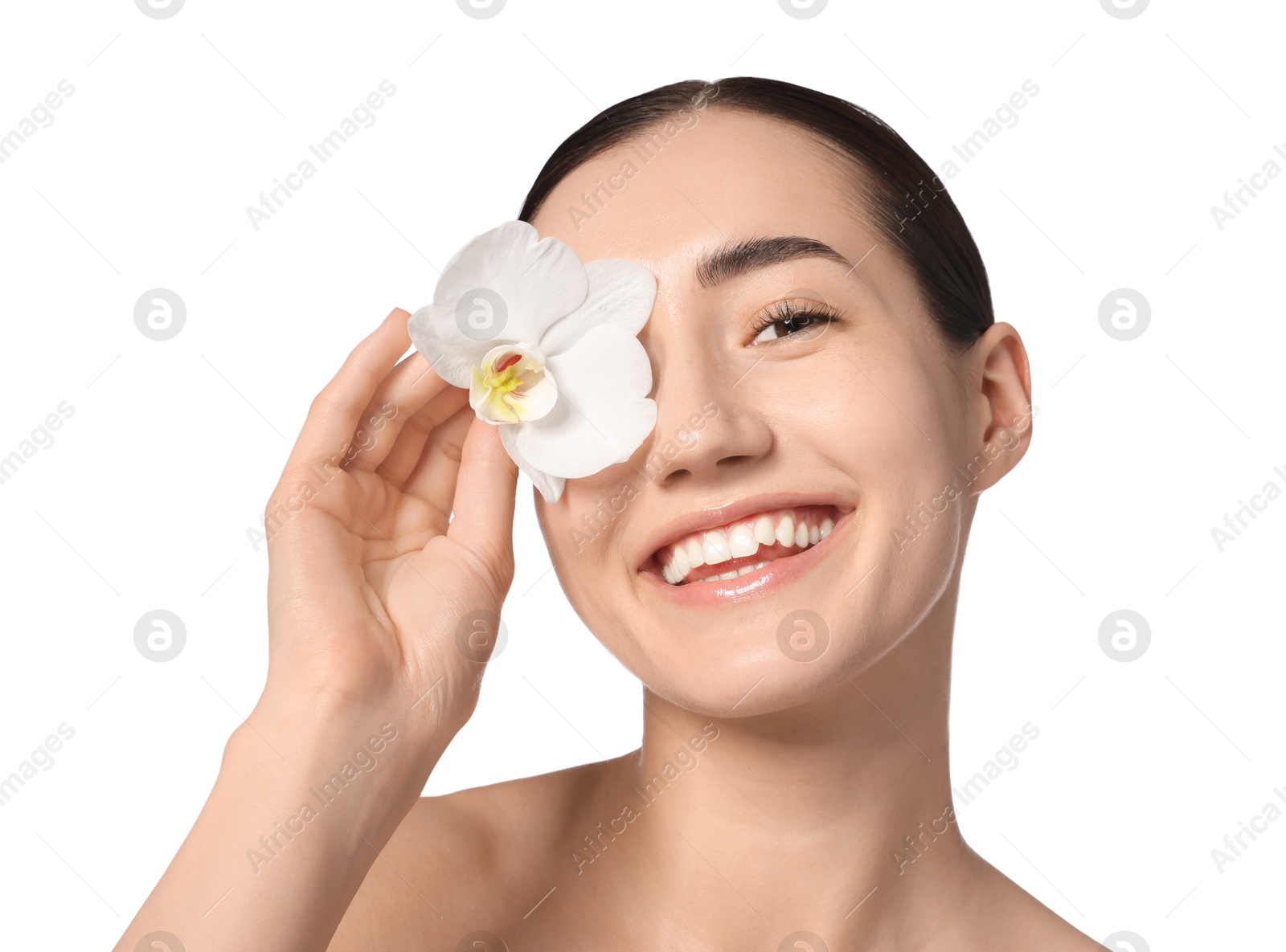 Portrait of smiling woman with orchid flower after spa treatment on white background, closeup Photo of Portrait of smiling woman with orchid flower after spa treatment on white background, closeup