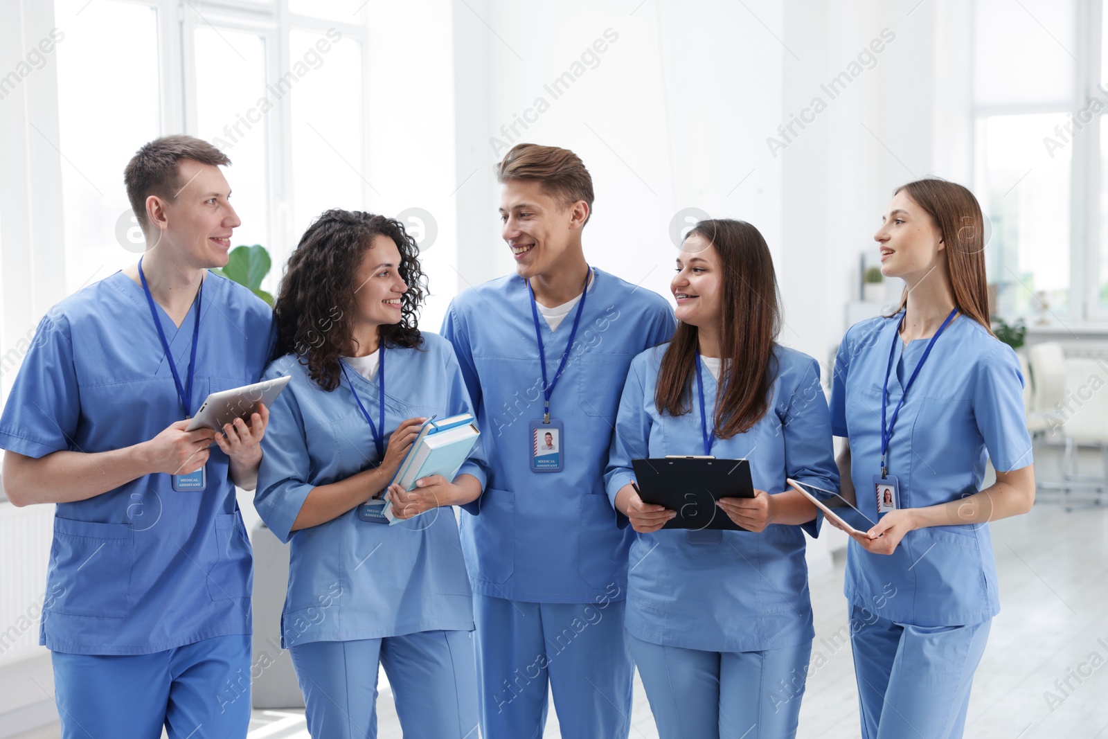 Group of medical students in uniforms indoors Photo of Group of medical students in uniforms indoors