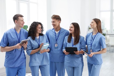 Photo of Group of medical students in uniforms indoors
