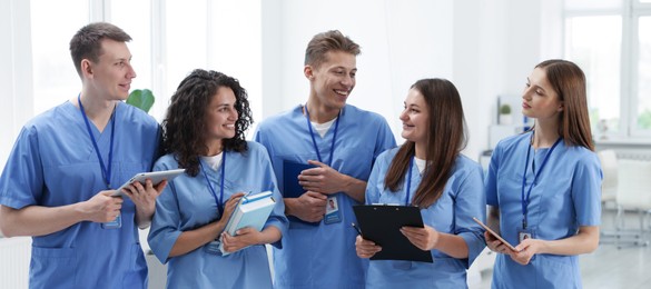 Photo of Group of medical students in uniforms indoors