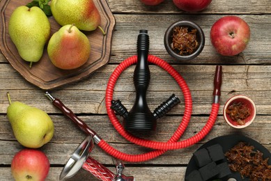 Photo of Hookah, coal and fresh fruits on wooden table, flat lay