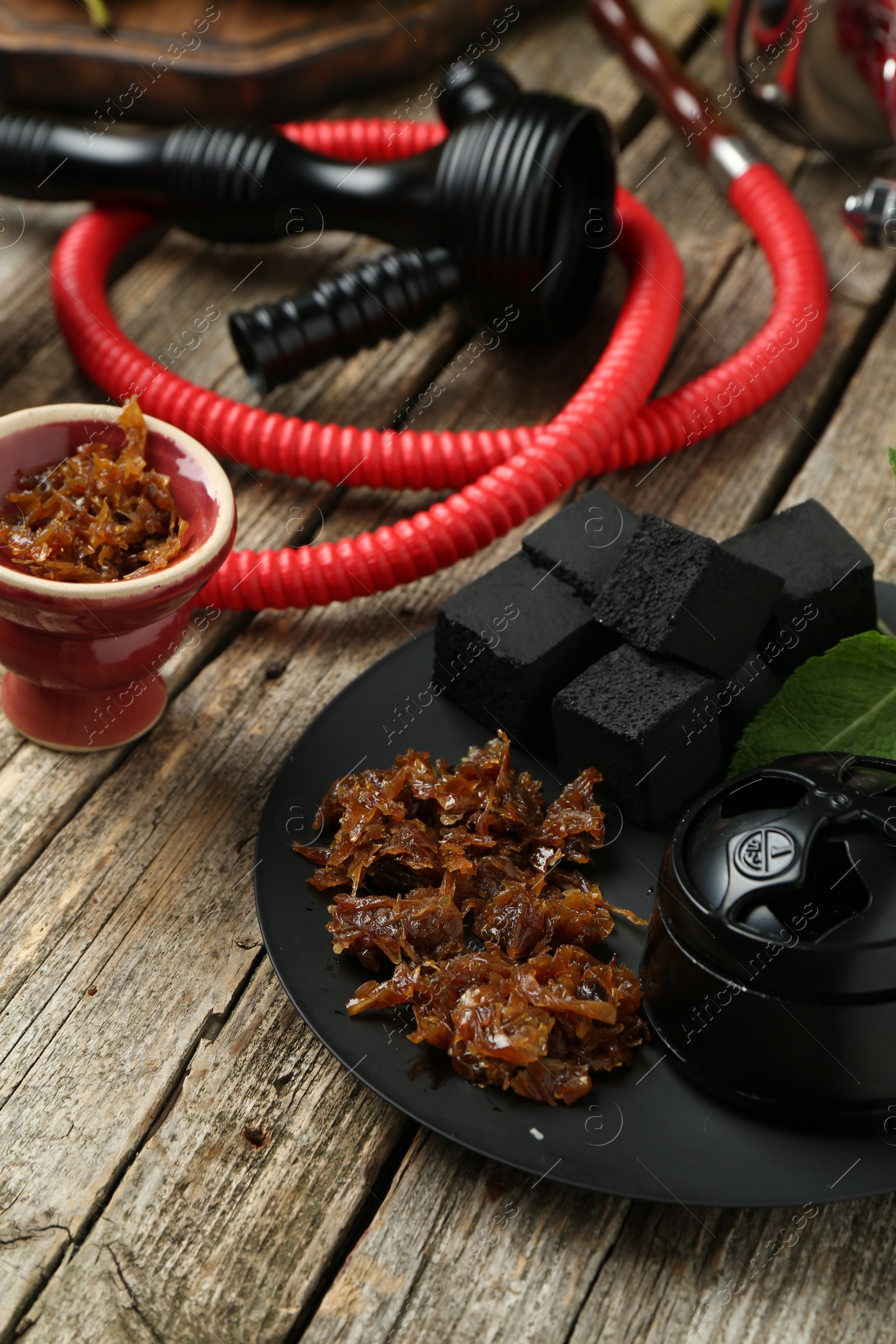 Hookah, coal and fresh fruits on wooden table, closeup Photo of Hookah, coal and fresh fruits on wooden table, closeup