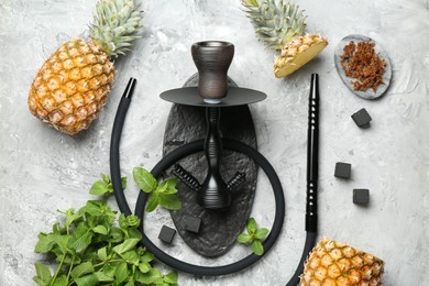 Photo of Hookah, coal and fresh fruits on grey table, flat lay