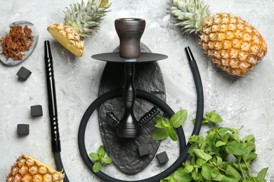 Photo of Hookah, coal and fresh fruits on grey table, flat lay