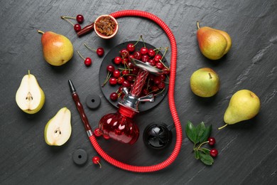 Photo of Hookah and fresh fruits on black table, flat lay