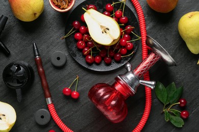 Photo of Hookah and fresh fruits on black table, flat lay