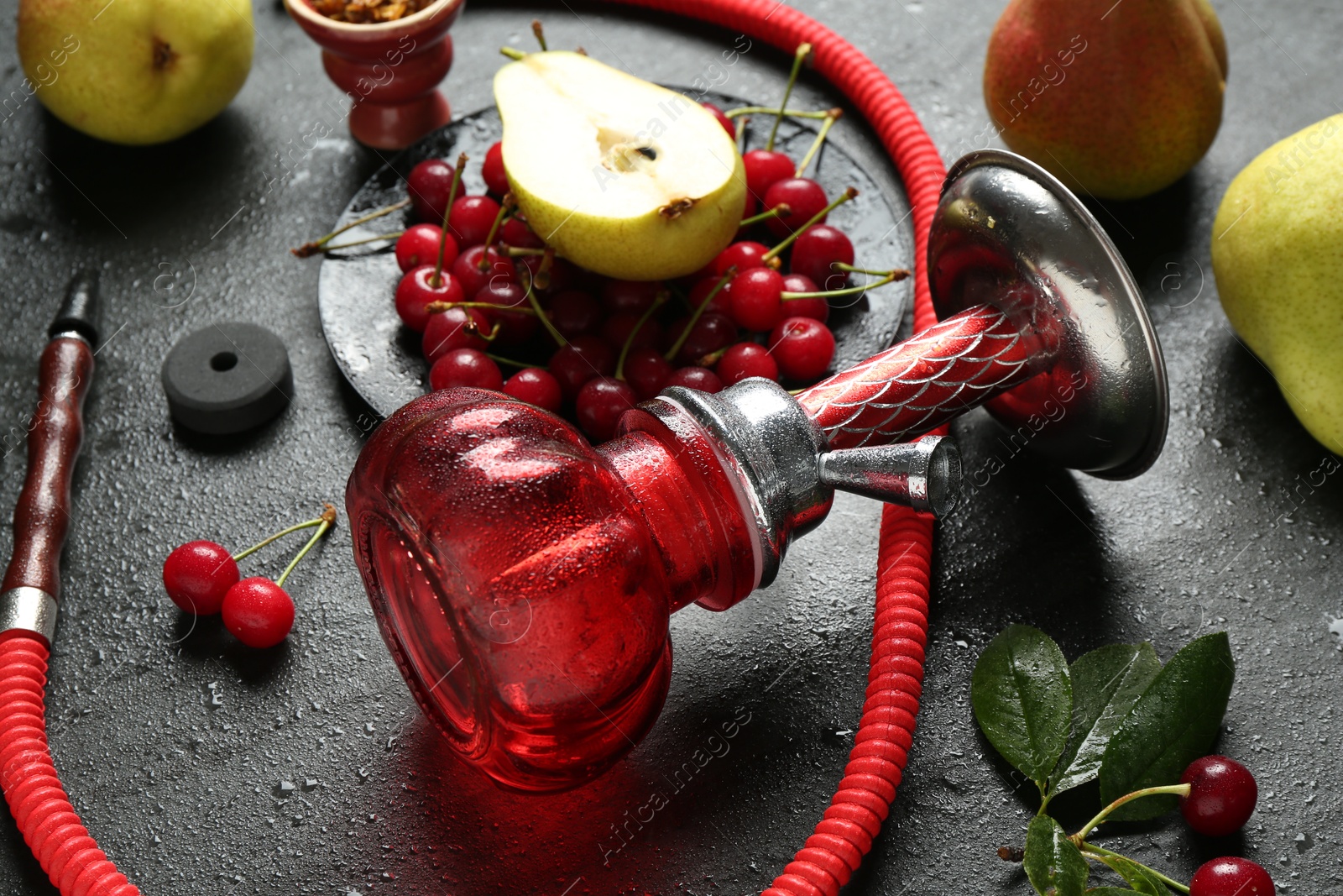 Hookah and fresh fruits on black table, closeup Photo of Hookah and fresh fruits on black table, closeup