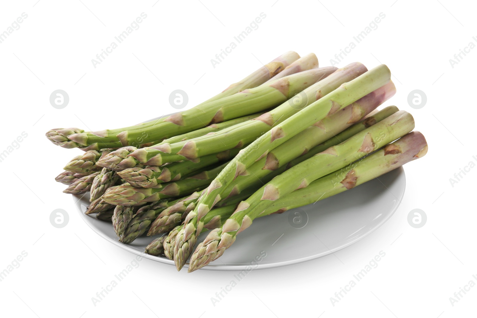 Fresh raw asparagus spears isolated on white Photo of Fresh raw asparagus spears isolated on white