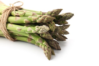 Photo of Bunch of fresh raw asparagus spears isolated on white