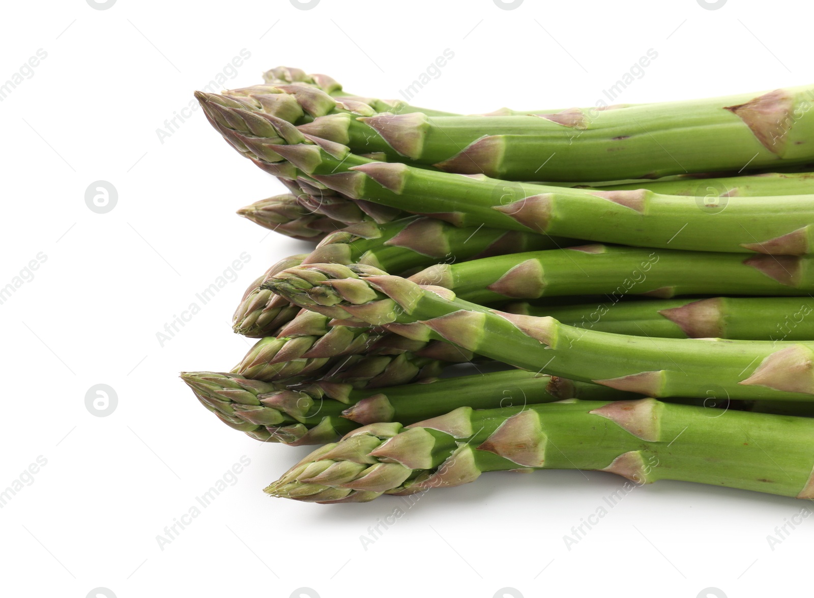 Fresh raw asparagus spears isolated on white Photo of Fresh raw asparagus spears isolated on white