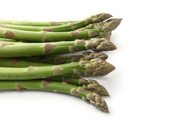 Photo of Fresh raw asparagus spears isolated on white