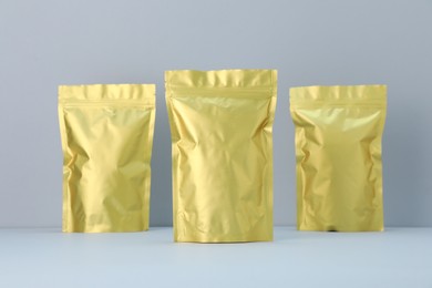 Photo of Zipper stand-up pouches on light grey background. Mockup for design
