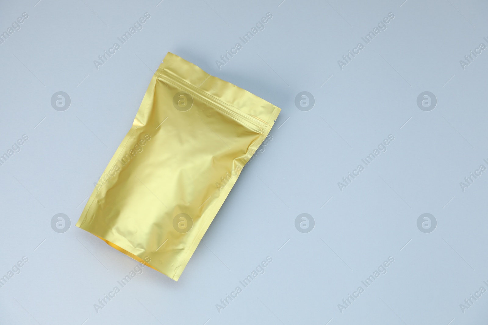 One zipper stand-up pouch on light grey background, top view. Mockup for design Photo of One zipper stand-up pouch on light grey background, top view. Mockup for design