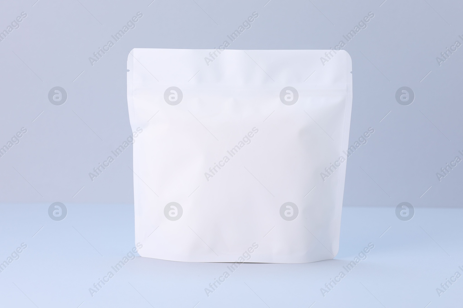 One zipper stand-up pouch on light grey background. Mockup for design Photo of One zipper stand-up pouch on light grey background. Mockup for design