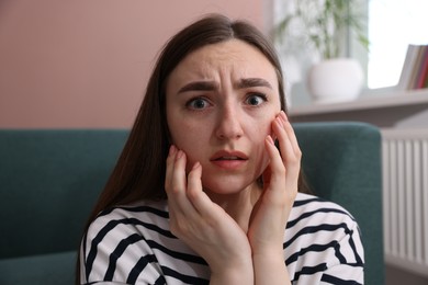 Photo of Worried woman suffering from paranoia at home