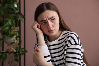 Photo of Worried woman suffering from paranoia at home