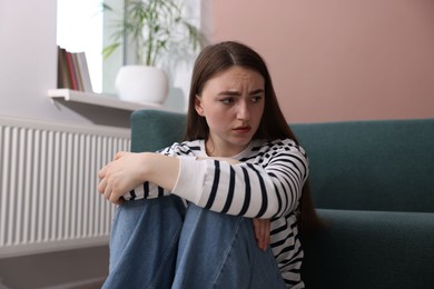 Photo of Worried woman suffering from paranoia at home