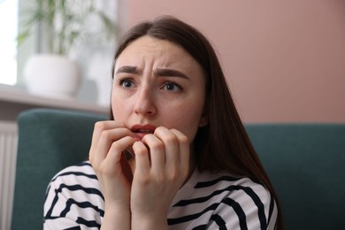 Photo of Worried woman suffering from paranoia at home