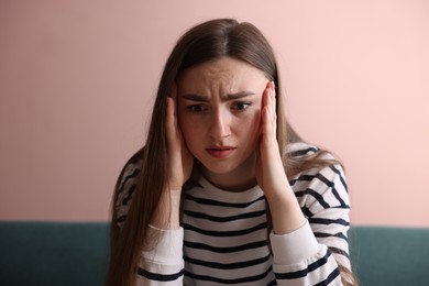 Photo of Scared woman suffering from paranoia at home