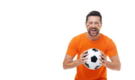 Image of Excited fan with flags of Germany painted on his body holding soccer ball against white background. Banner design with space for text