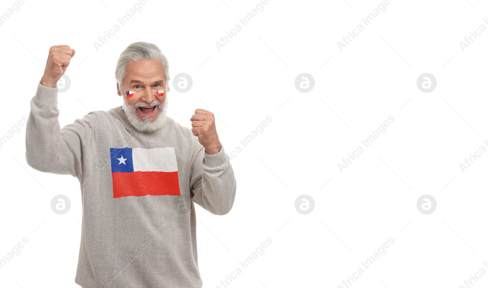 Excited fan with flags of Chile on his face and sweater against white background. Banner design with space for text Image of Excited fan with flags of Chile on his face and sweater against white background. Banner design with space for text