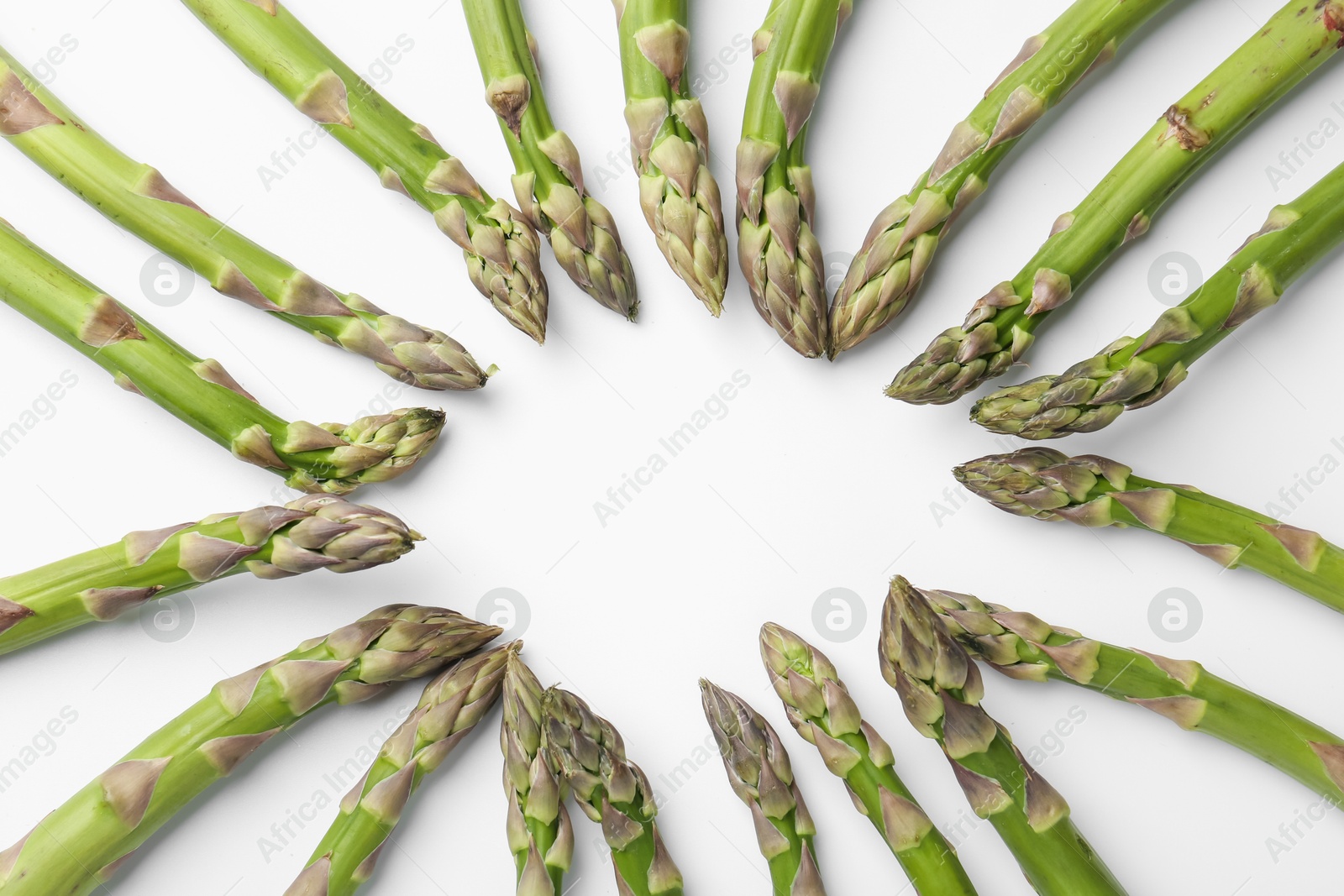 Frame of raw asparagus on white background, flat lay. Space for text Photo of Frame of raw asparagus on white background, flat lay. Space for text