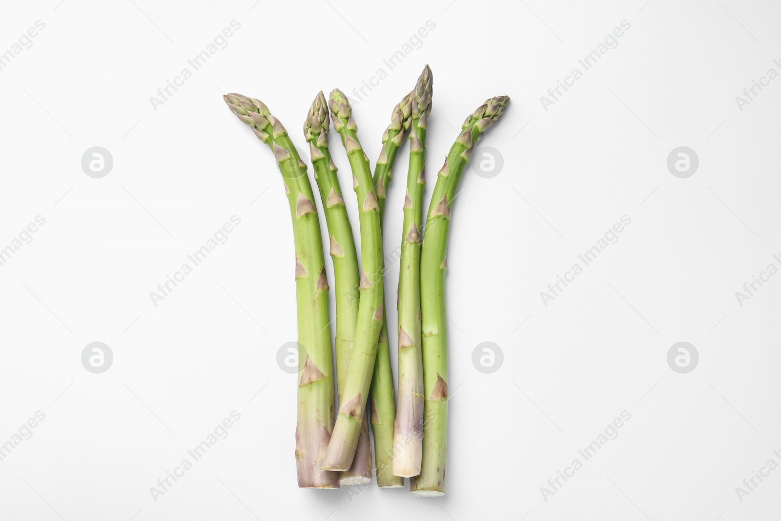 Fresh ripe raw asparagus on white background, flat lay Photo of Fresh ripe raw asparagus on white background, flat lay