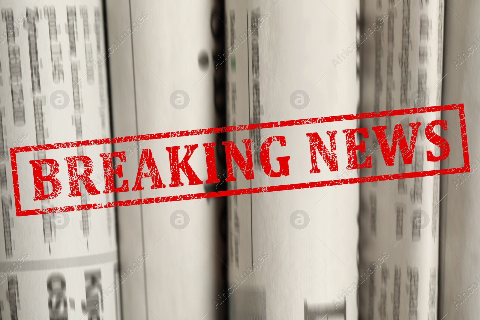 Red Breaking News stamp and newspapers as background, closeup Image of Red Breaking News stamp and newspapers as background, closeup