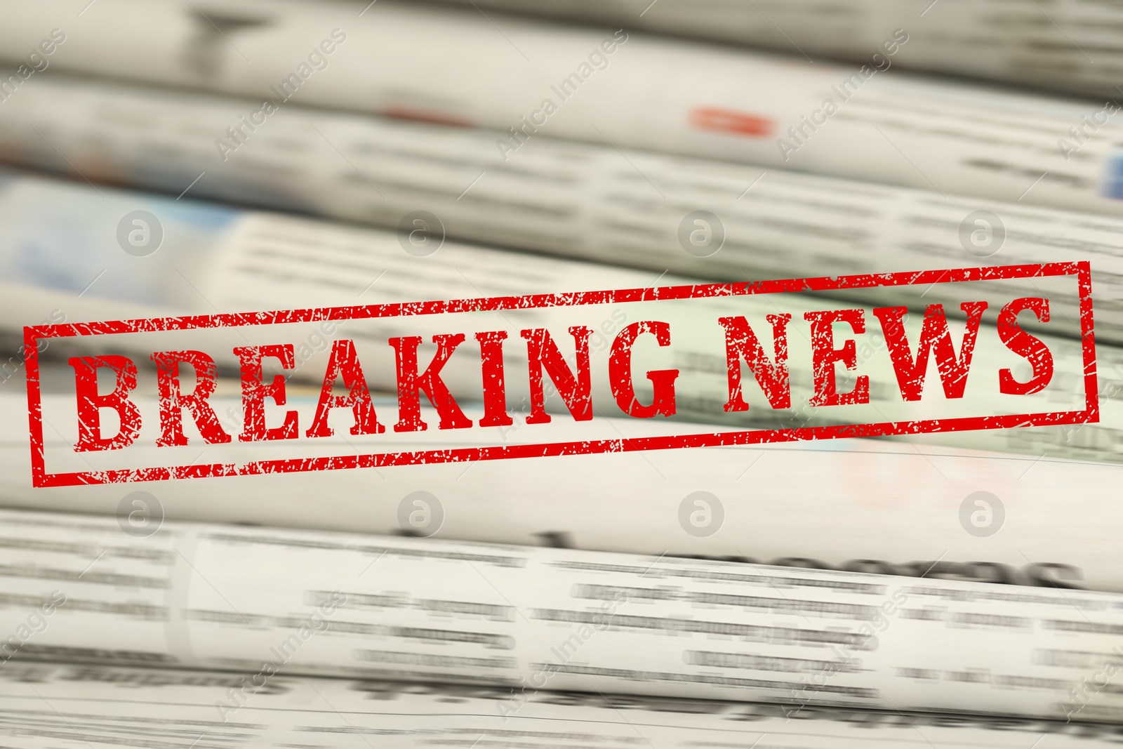Red Breaking News stamp and newspapers as background, closeup Image of Red Breaking News stamp and newspapers as background, closeup