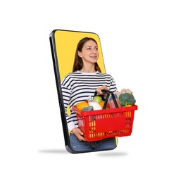 Image of Woman with shopping basket full of products walking out of mobile phone against white background. Online ordering