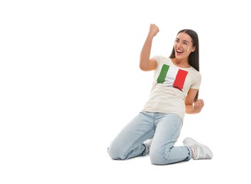 Image of Excited fan with flags of Italy on her cheek and t-shirt against white background. Celebrating victory