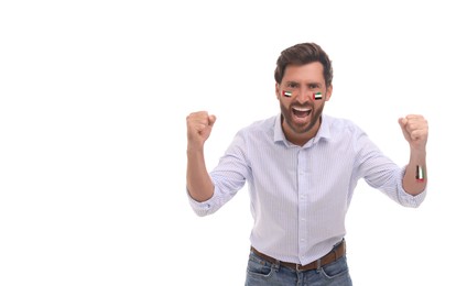 Image of Excited fan with flags of United Arab Emirates painted on his body against white background. Banner design with space for text