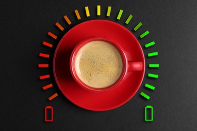 Image of Cup of coffee and energy gauge on black background, top view. Low level battery becoming fully charged after caffeine consumption