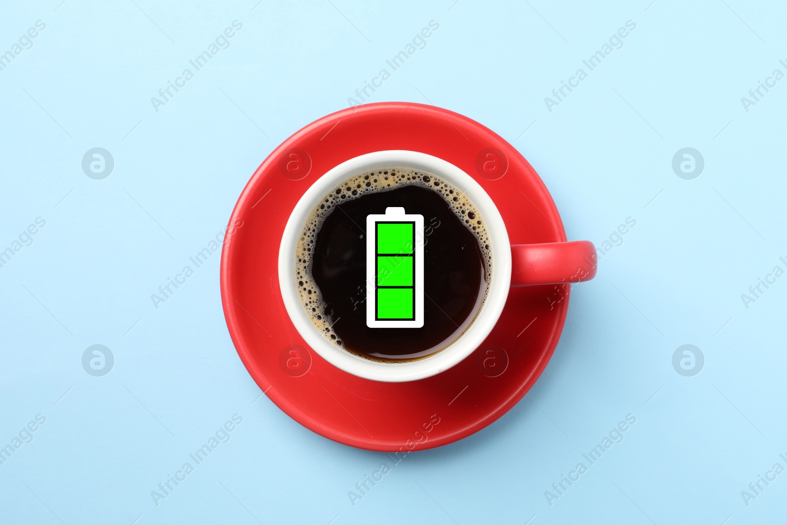 Cup of coffee with fully charged battery indicator on light blue background, top view. Restoring energy with caffeine Image of Cup of coffee with fully charged battery indicator on light blue background, top view. Restoring energy with caffeine