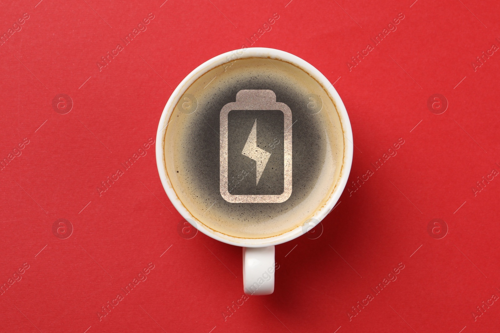 Cup of coffee with battery indicator on red background, top view. Restoring energy with caffeine Image of Cup of coffee with battery indicator on red background, top view. Restoring energy with caffeine