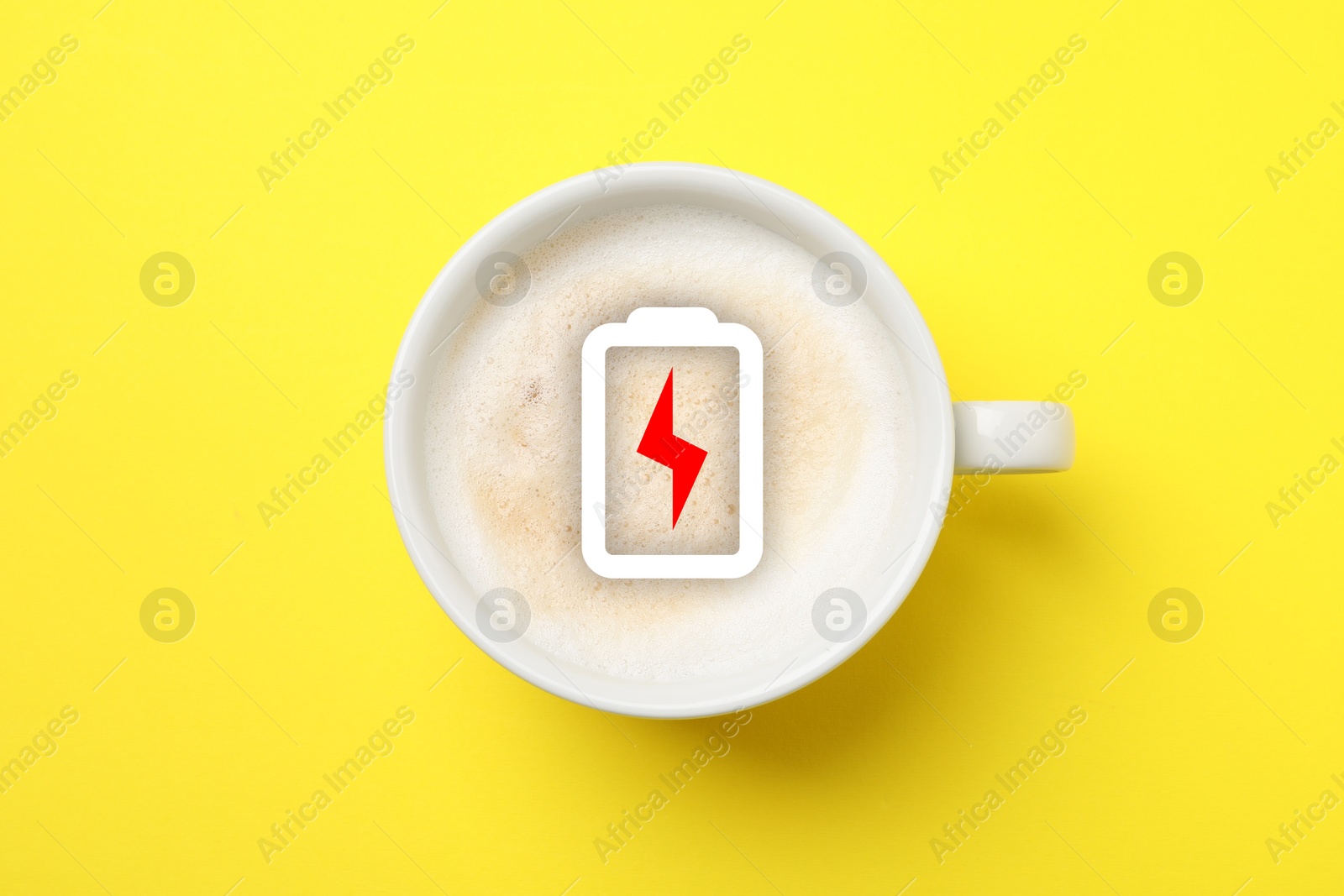Cup of coffee with battery indicator on yellow background, top view. Restoring energy with caffeine Image of Cup of coffee with battery indicator on yellow background, top view. Restoring energy with caffeine