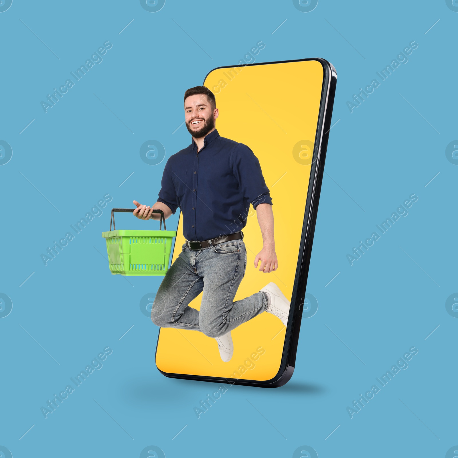 Man with shopping basket jumping out of mobile phone against light blue background. Online ordering Image of Man with shopping basket jumping out of mobile phone against light blue background. Online ordering