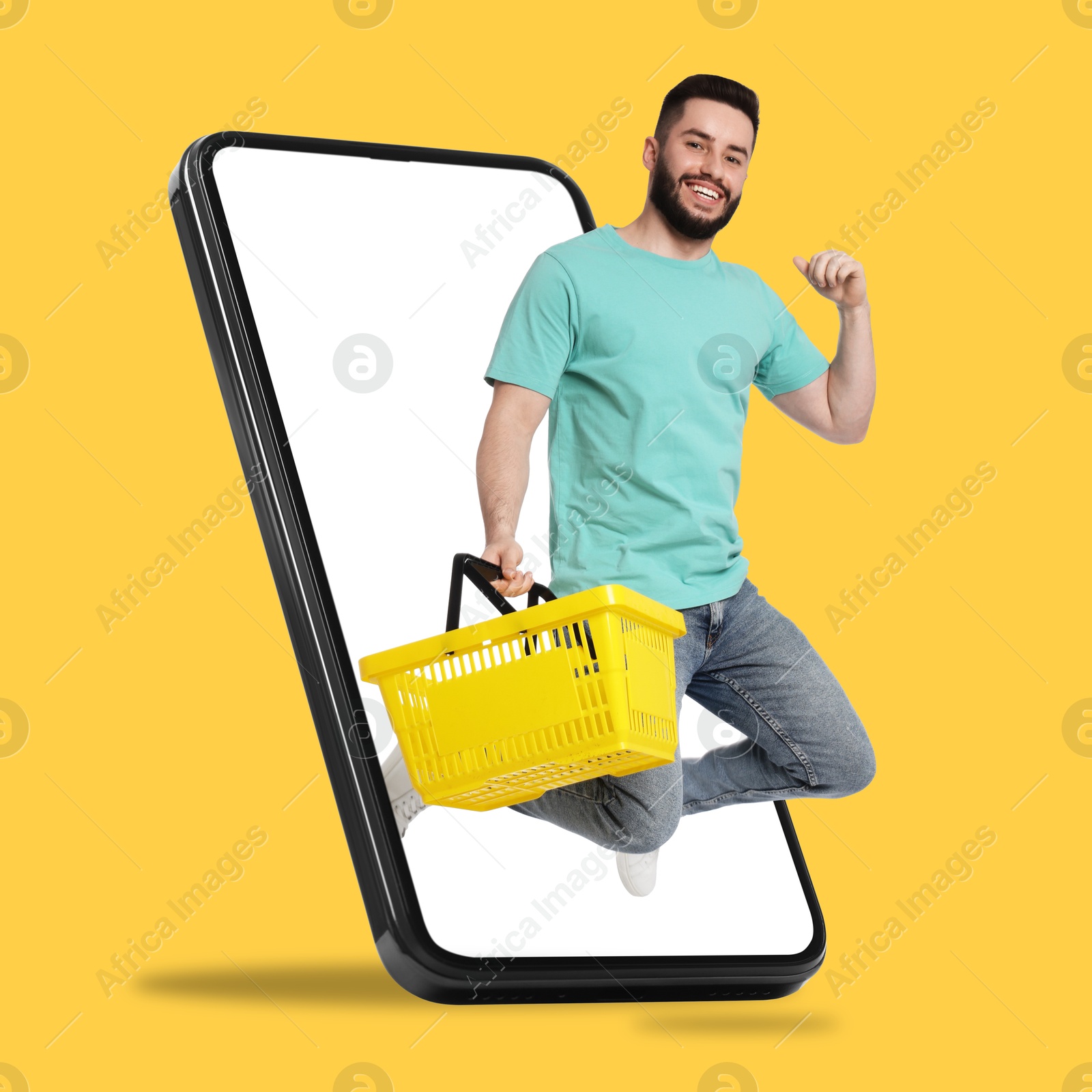 Man with shopping basket jumping out of mobile phone against orange background. Online ordering Image of Man with shopping basket jumping out of mobile phone against orange background. Online ordering