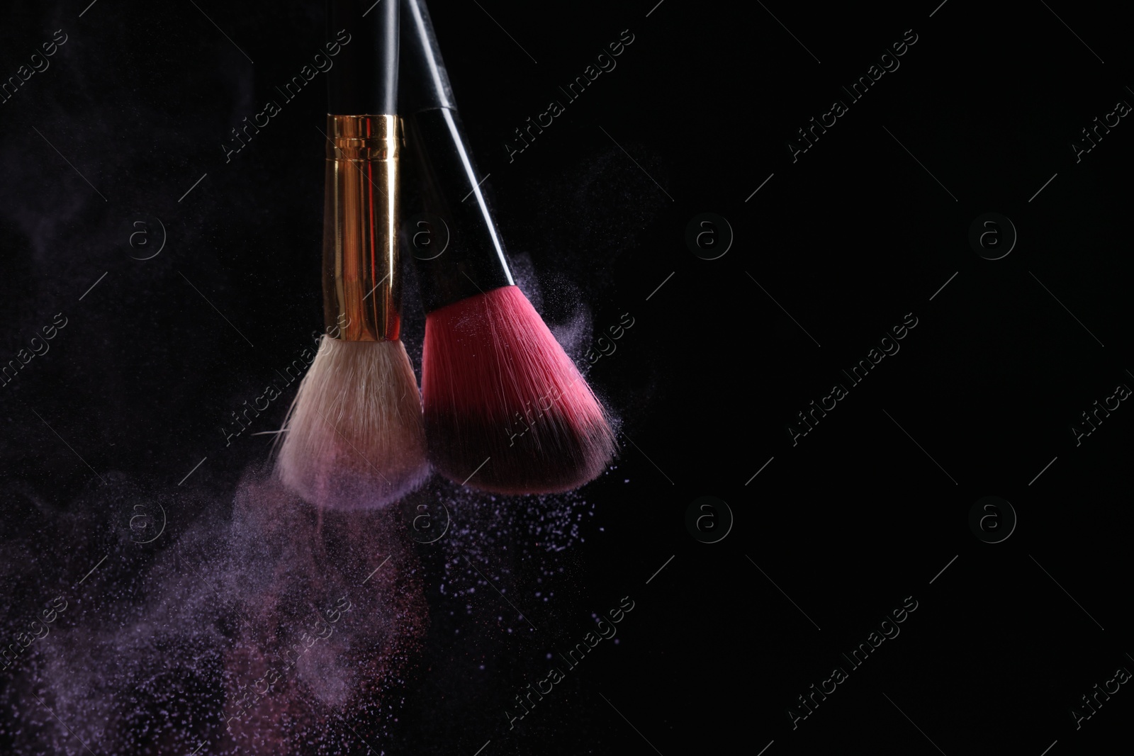 Makeup brushes with colorful eye shadows on black background, closeup. Space for text Photo of Makeup brushes with colorful eye shadows on black background, closeup. Space for text