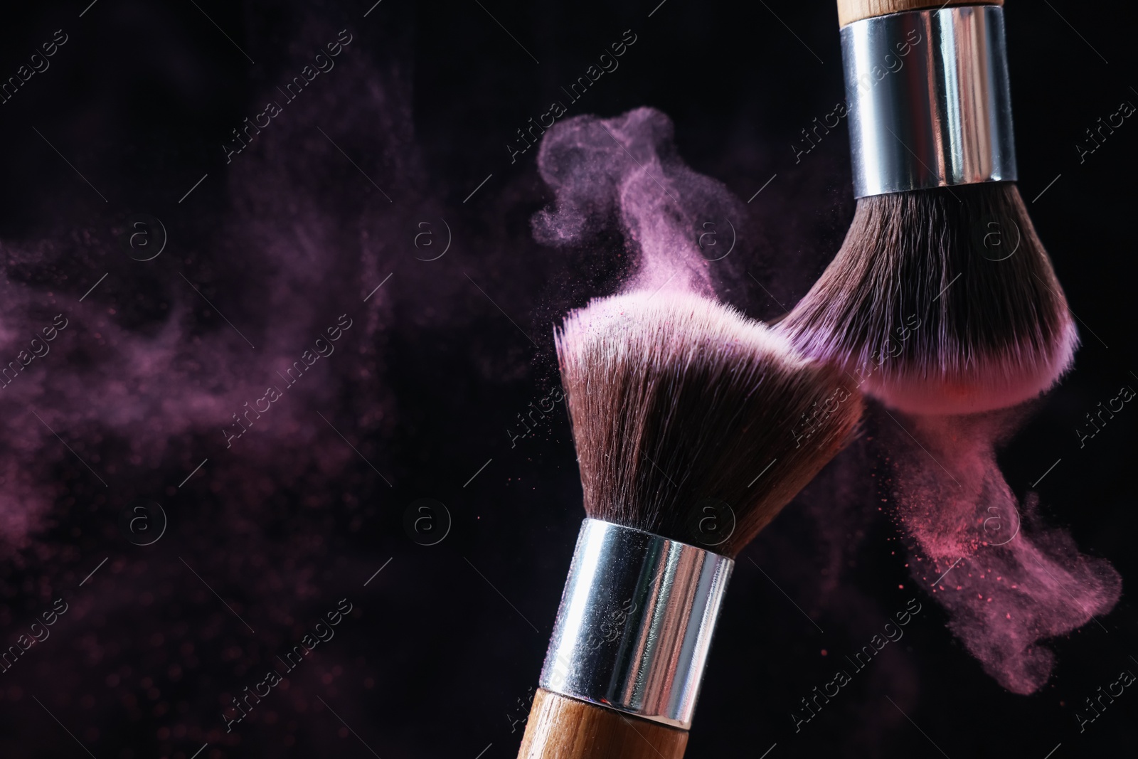 Makeup brushes with color eye shadow on black background, closeup. Space for text Photo of Makeup brushes with color eye shadow on black background, closeup. Space for text