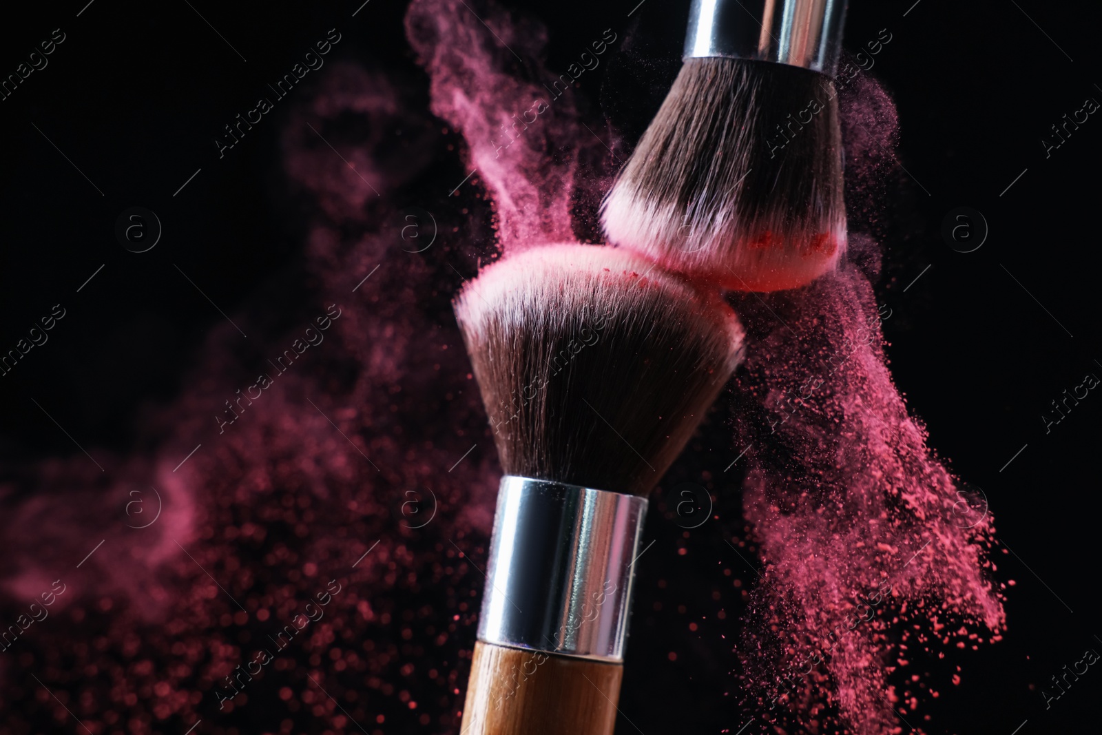 Makeup brushes with color eye shadow on black background, closeup Photo of Makeup brushes with color eye shadow on black background, closeup
