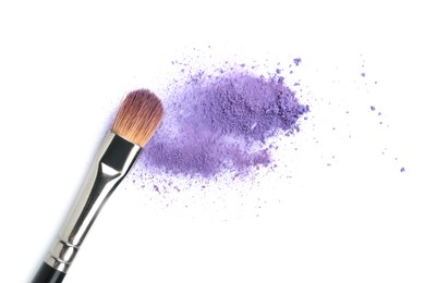 Photo of Makeup brush with purple eye shadow isolated on white, top view